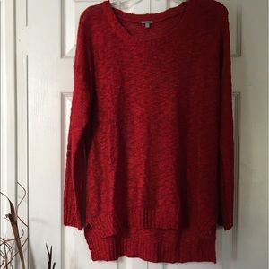 Red kind of sweater.